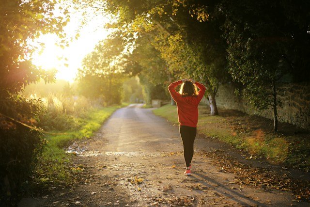 Active person fast walking on a natural outdoor path during a daily exercise routine