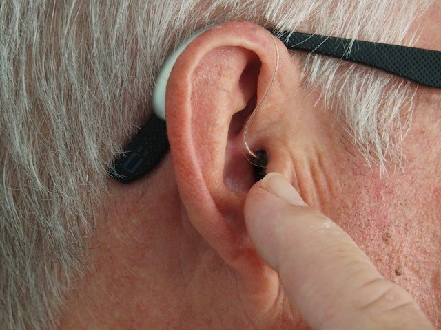 Senior woman having her eyes examined by an eye specialist to protect cognitive health