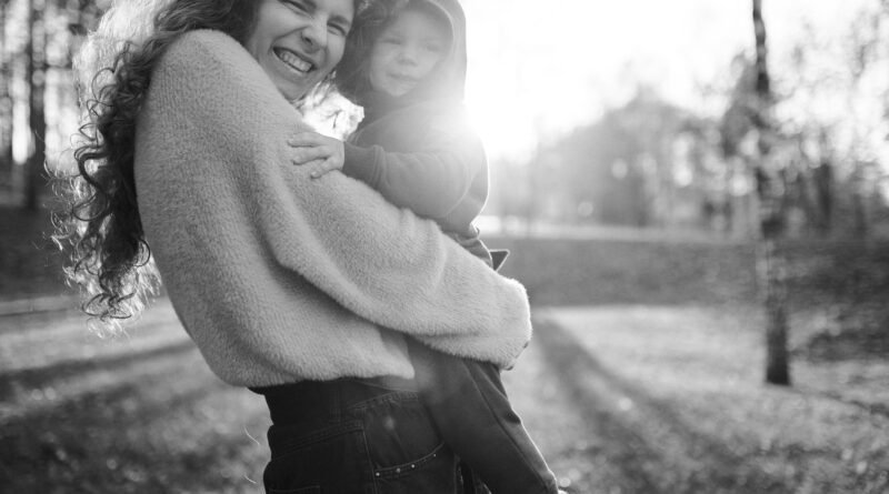 Mother and adult child together representing the lifelong cellular connection created during pregnancy