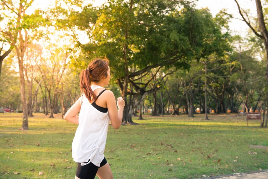 Older adult walking outdoors during moderate exercise while enjoying a calm, energized mood.