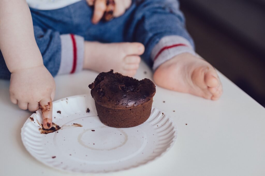 Parent preparing nutritious low-sugar food for a young child during early development