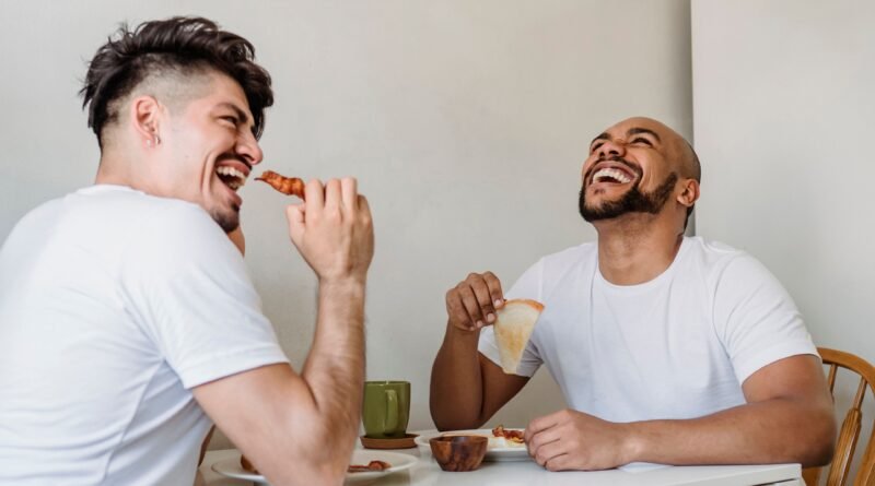 Friends sharing a genuine laugh, illustrating the potential connection between social connection, stress relief and heart health.